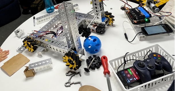 Students working with a robotics project